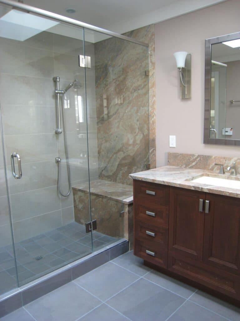 standing shower with glass and vanity